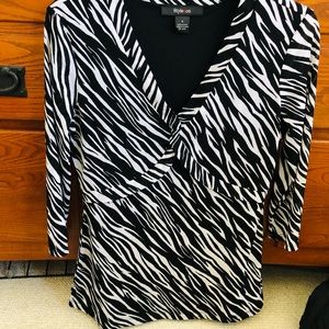 Style&co 3/4 length sleeves. Nice light weight material and very comfortable.